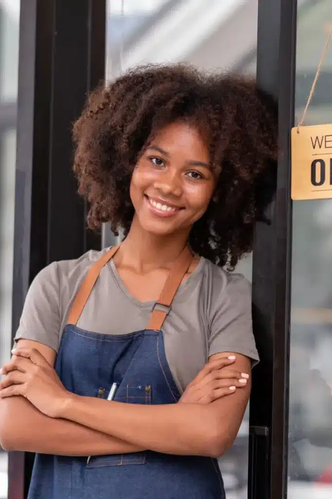 female entrepreneur outside of her shop